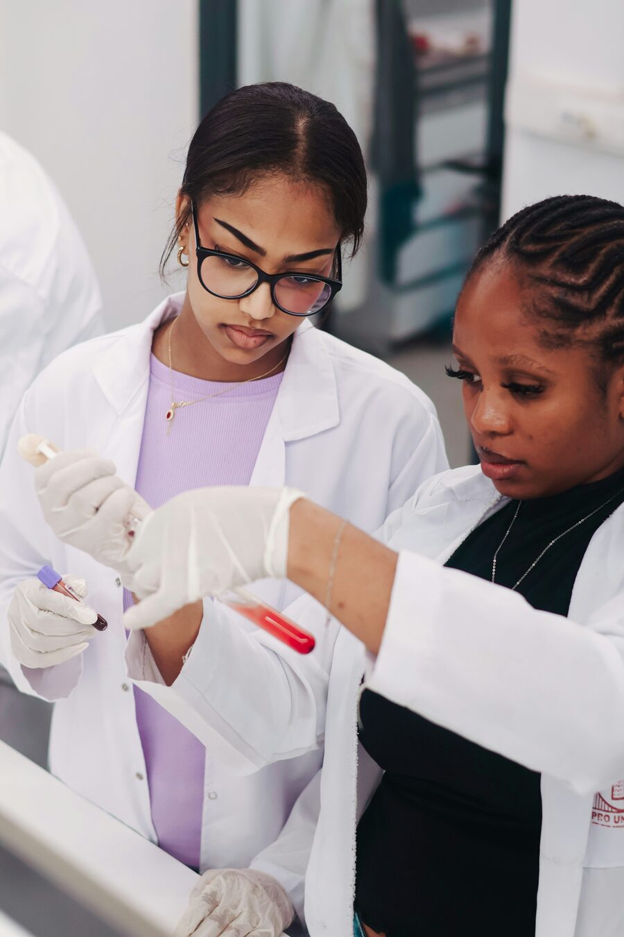Pharmaceutical scientists handling supply and quality samples